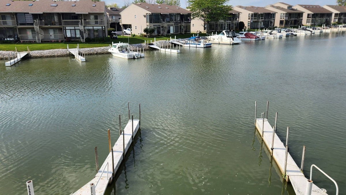Oak Harbor Condo | Gorgeous waterfront balcony view & boat dock on the shores of Lake Erie