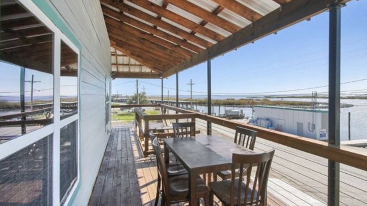 Delacroix Cabin | Great view of bayou-fishing lodge- sleeps 6. Fish cleaning station & bbq pits.