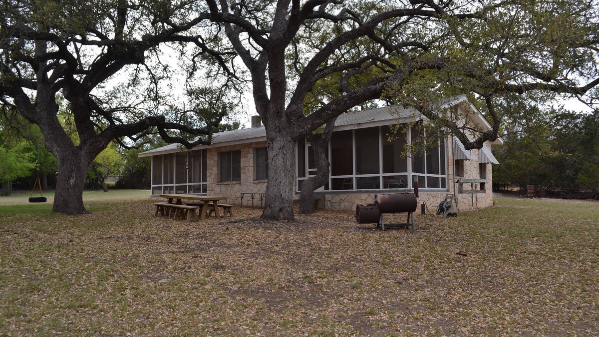 Hunt House | Guadalupe riverfront wooded Hill Country acreage located in Downtown Hunt, TX