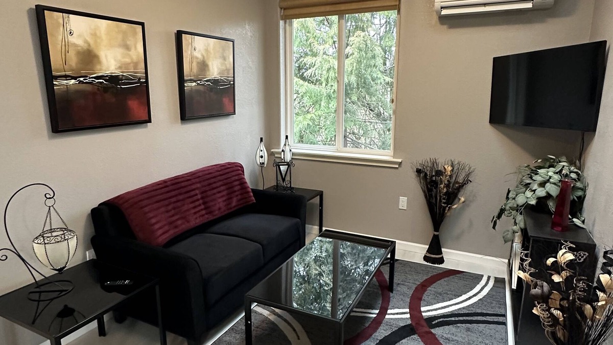 Meadow Glade Cottage | Guest House nestled in the trees with large deck, full kitchen, and laundry