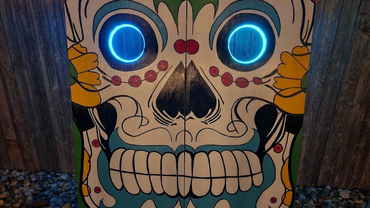 Harlandale House | Halloween House sugar skull corn hole, life size Checkers, Horseshoe, Foosball
