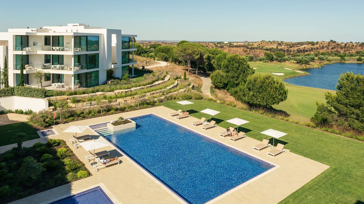 Vila Nova De Cacela Apartment | Heated pool, lush gardens, and air conditioning at Monte Rei.