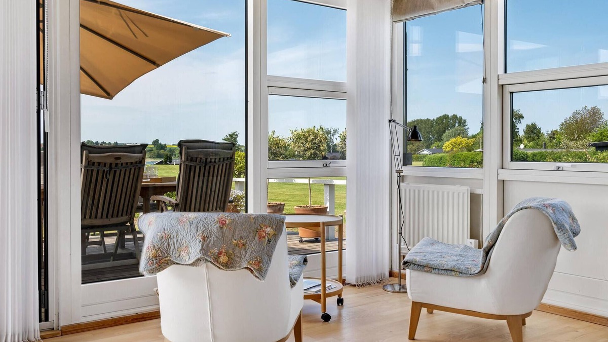 Roskilde House | Highly furnished wooden house with wood-burning stove, fjord view and boat dock.