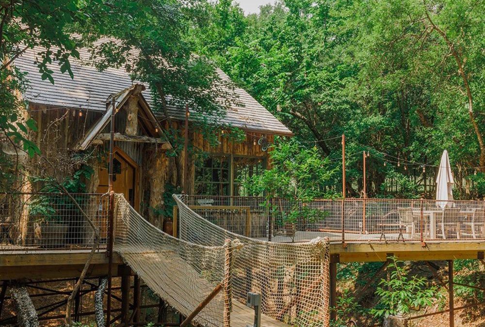Dennis Ski Chalet | Hobbit Treehouse with waterfall on the Brazos River! 350 acres! Tubing! Petting zoo!