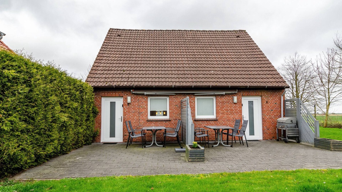 Wangerland Apartment | Holiday Apartment "Nordsee 1" with Shared Terrace, Shared Garden & Wi-Fi