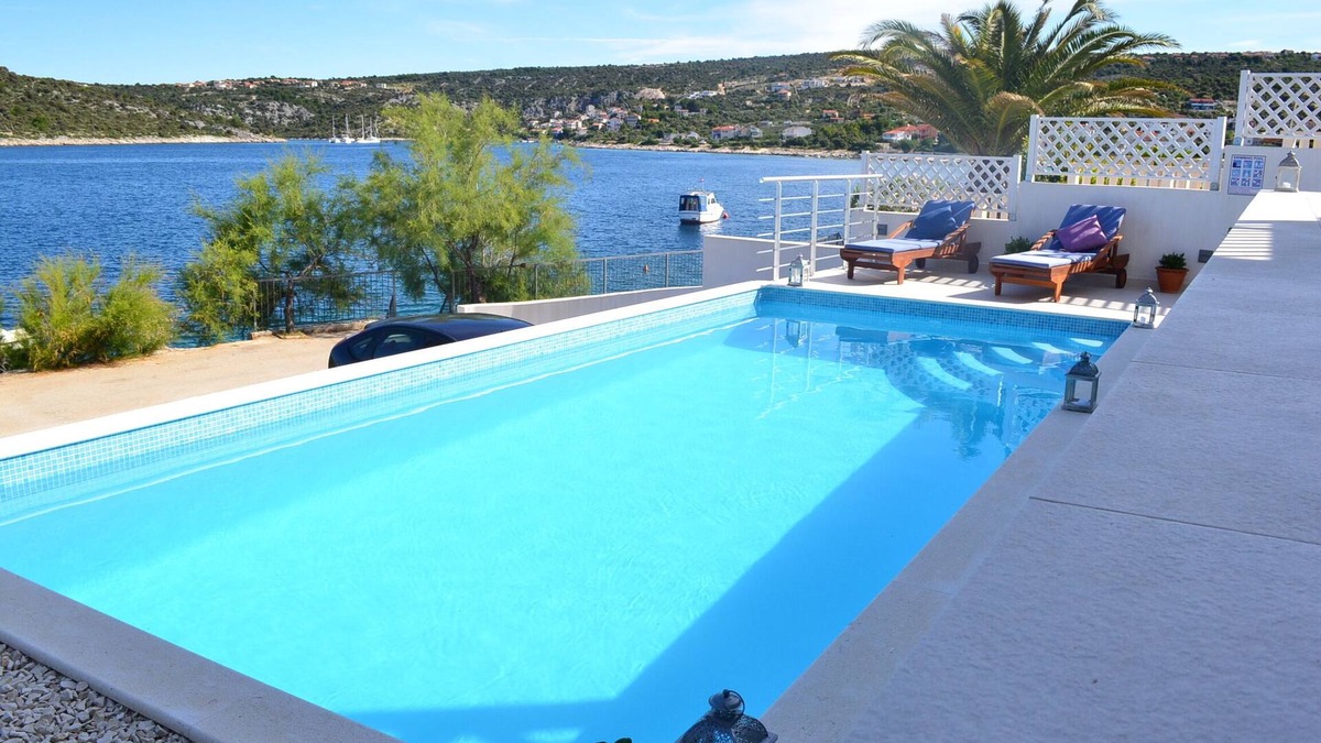 Sevid House | Holiday beach house with private heated pool and buoy