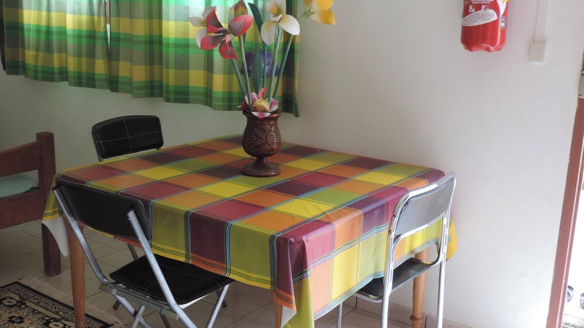 Le Robert Apartment | Homerez - Apt. Central in Le Robert, Garden View.