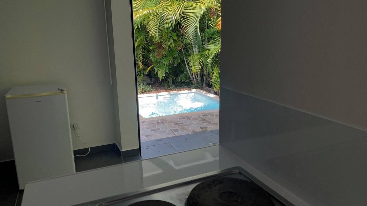 L'Autre-Bord Apartment | Homerez - Apt. in Le Moule, pool view