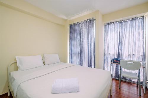 Kayu Putih Apartment | Homey and Cozy Living Studio Room at Tifolia Apartment By Travelio