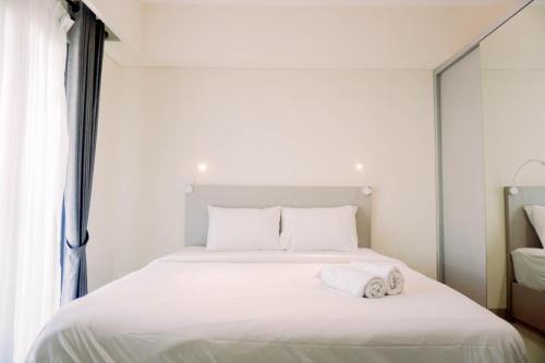 Pondok Aren Apartment | Homey and Simply Look 1BR Bintaro Embarcadero Apartment By Travelio