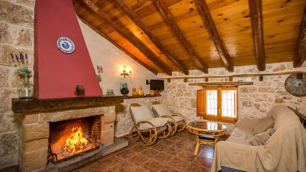 Beceite Apartment | House Ana III. Attic terrace and fireplace