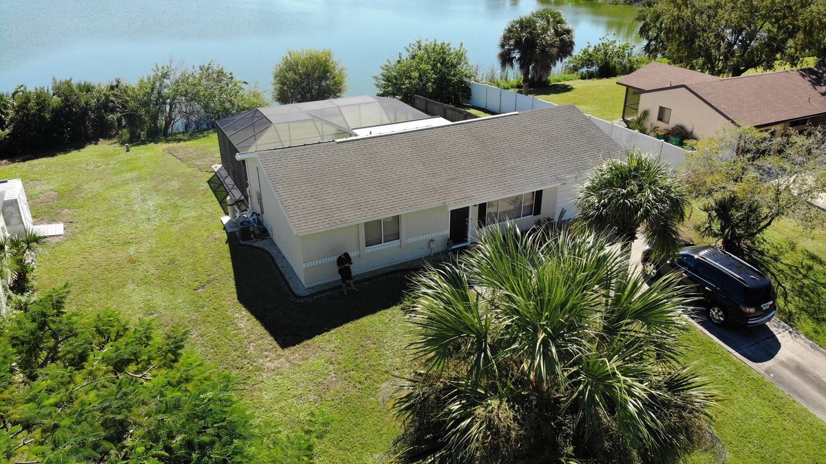 Port Charlotte House | House with solar heated pool and lake view!
