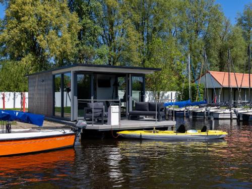 Heeg Boat Rental | Houseboat in Heeg with Stunning Marina Views