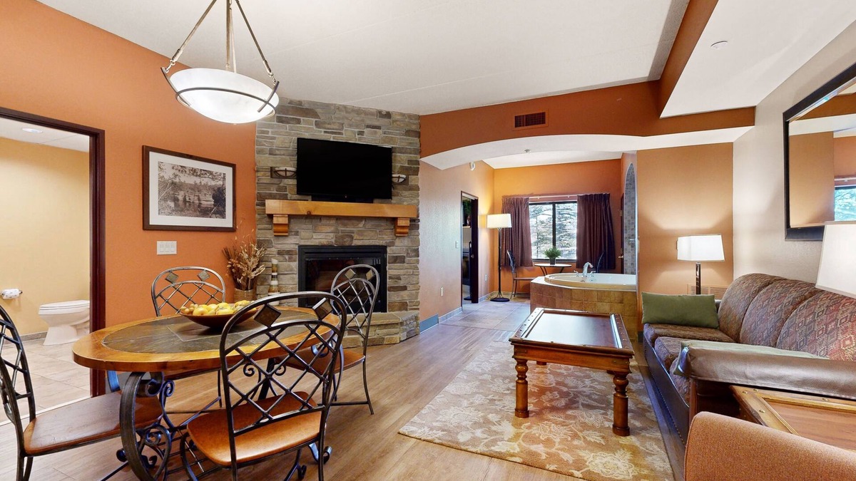 Lyndon Station Condo | Ideally located condo with fireplace, jetted tub, on-site golf, & central AC