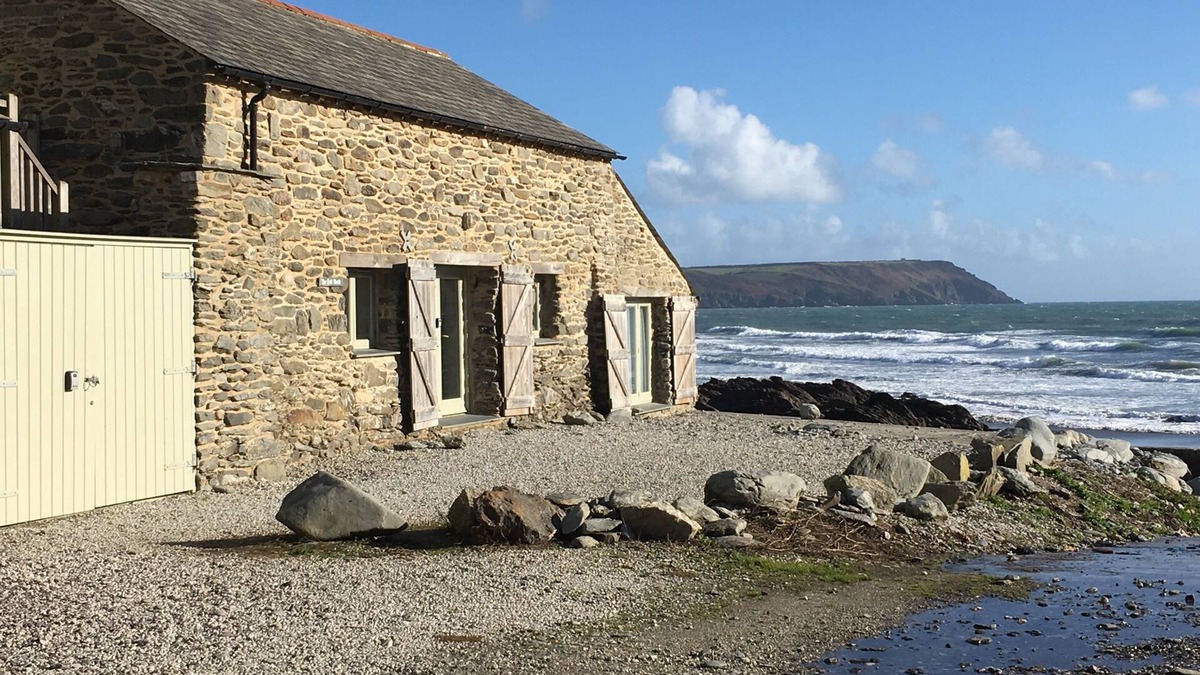 Portholland Cottage | In an exceptional position right on the beach is this spacious and comfortable cottage - a perfect g