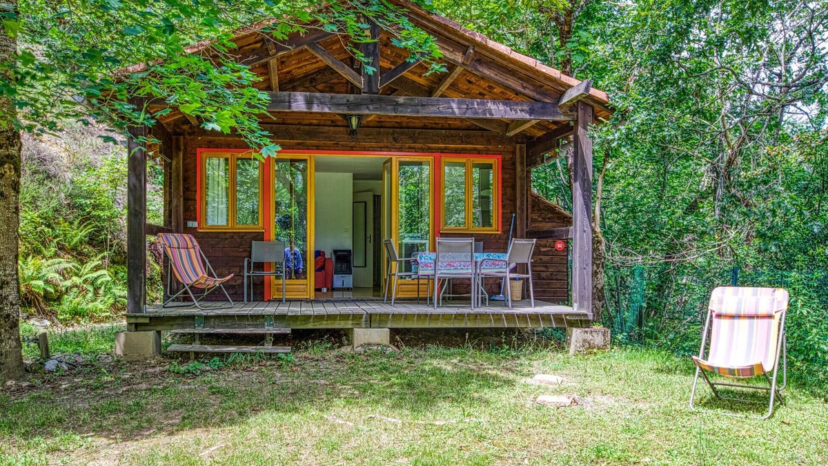 Mirandol-Bourgnounac House | In idyllic location of a forest and near the river Vaur is this cozy wooden house.