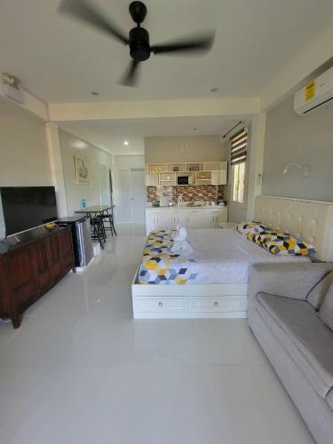 Panglao House | INATO SUITES Rm 1 1 queen bed and a pullout sofa bed