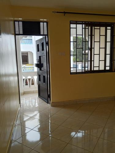 Manyimbo House | Indian ocean apartments you get the master bedroom with the private bathroom and the host sleeps in the other bedroom you share kitchen anc living room