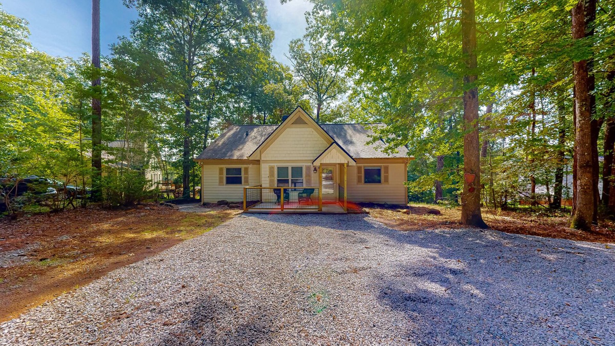 Hardwick House | Inviting waterfront home with fireplace, dock, patio, central AC, & W/D