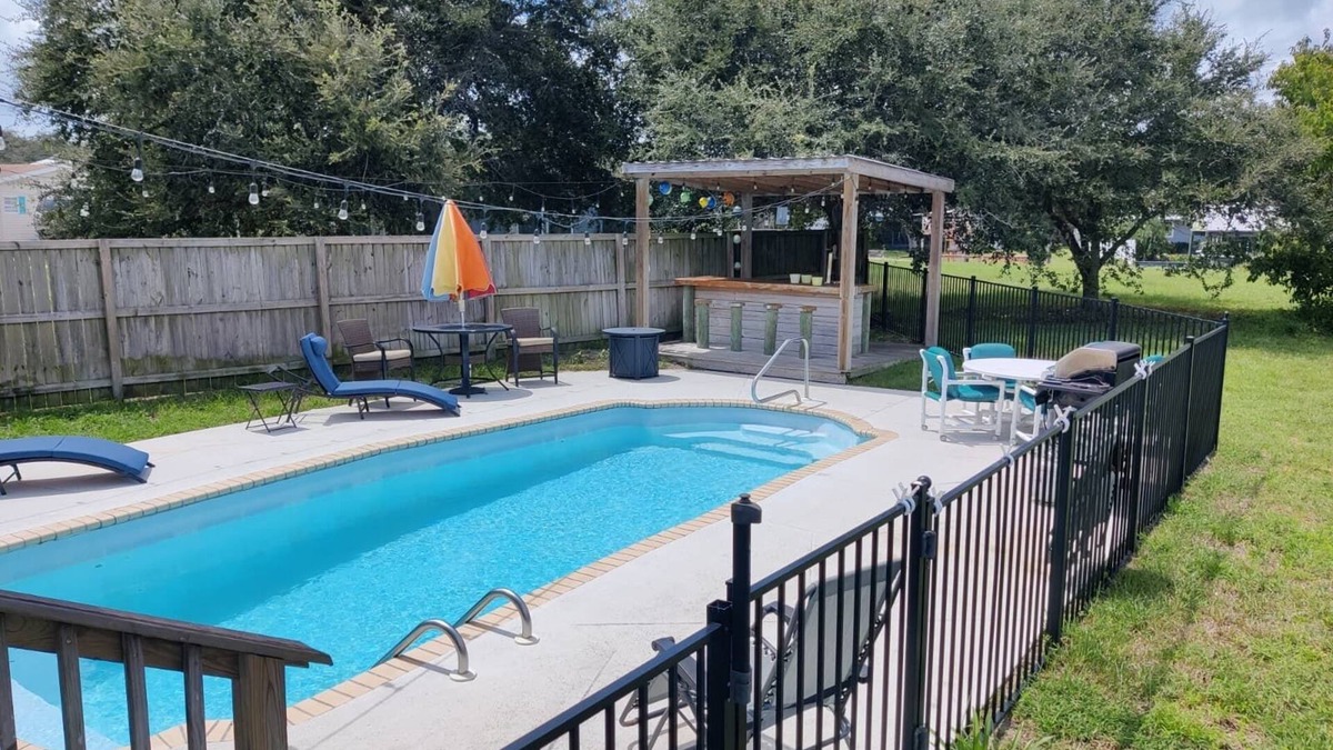 Butler Beach House | Island Escape - Water Views, Heated Pool, Boat Dock, Walk to Beach