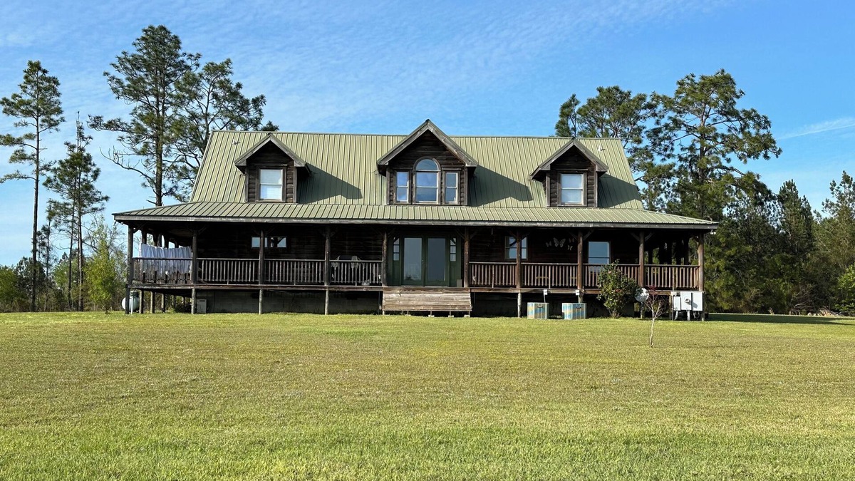 Toombs County Cabin | Kennedy Family Cabin- a large log cabin in a rural, farming community