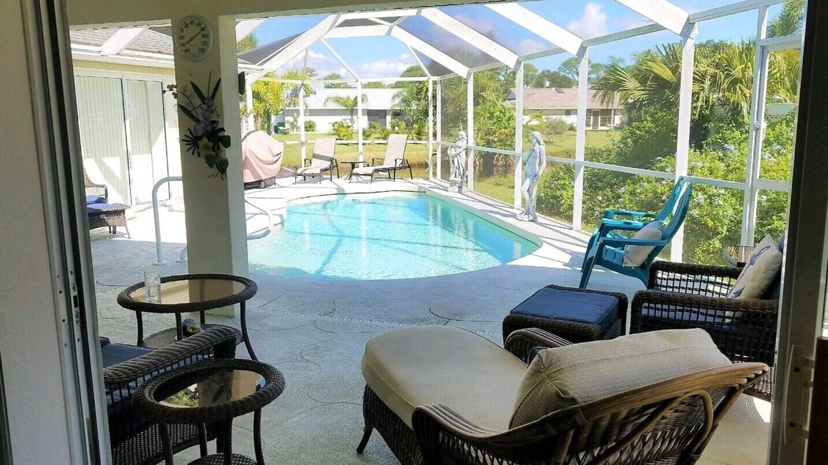 Pebble Beach House | La dolce vita awaits in this immaculate pool home on fresh water canal.