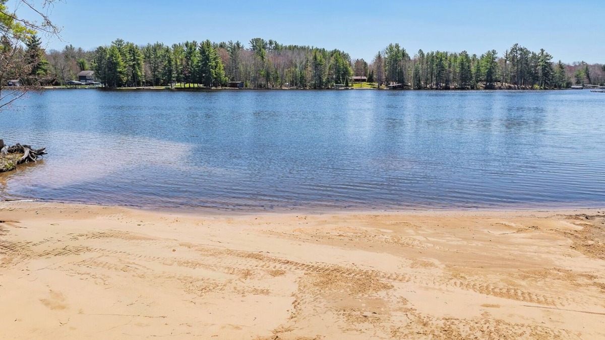 Eagle River Condo | Lake Forest Resort – Relax on a Pristine Sandy Beach in the Northwoods!