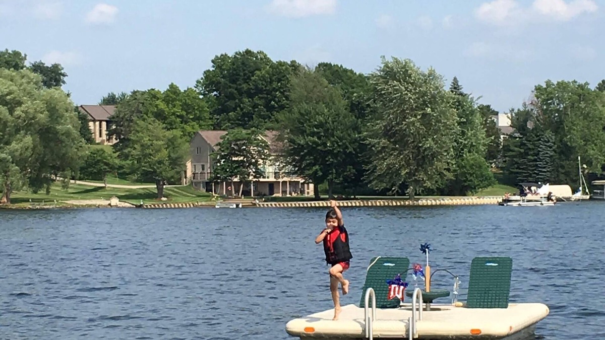 Brighton Cottage | Lake Front Cottage on Woodland Lake with private beach, boat and jet ski docks.