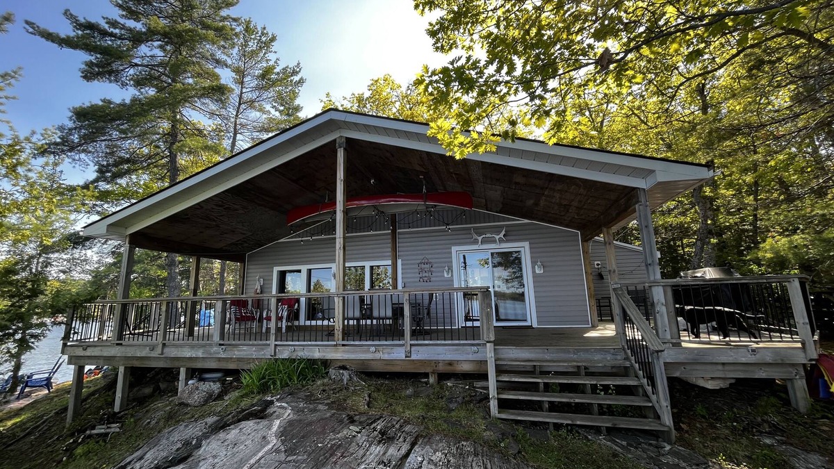 Catchacoma Cottage | Lake view cottage, clean weed free swimming and a hot tub on Mississagua Lake