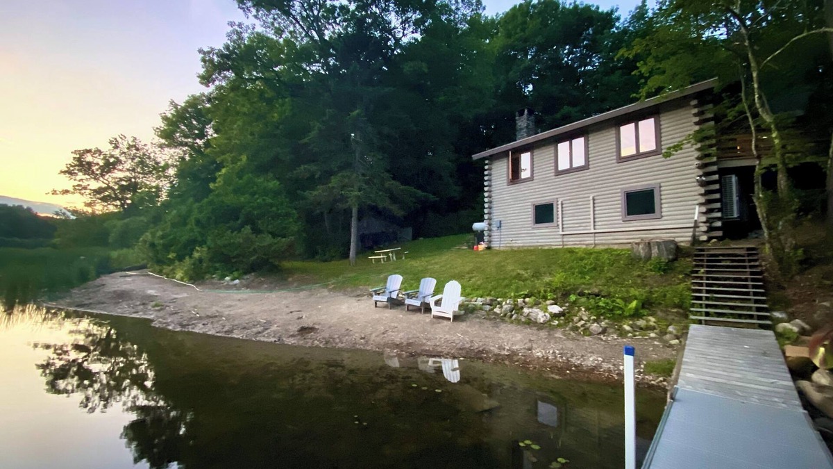 Plymouth House | Lakefront cabin with dock, hot tub, fire pit!