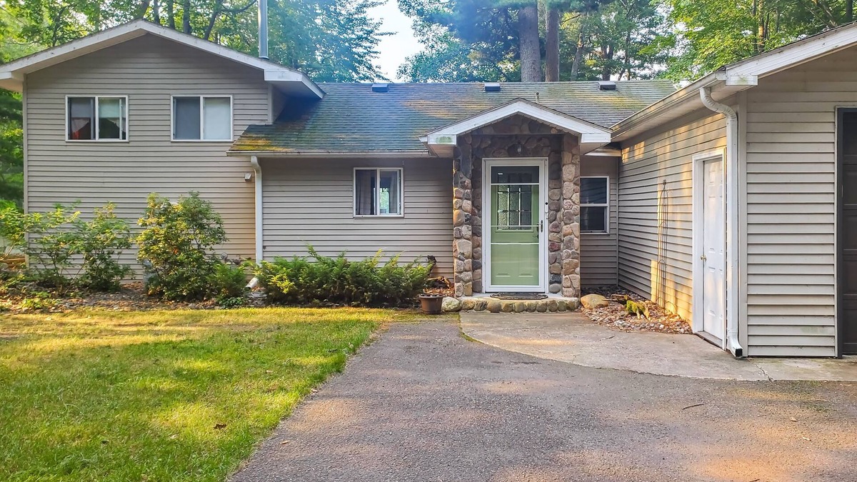 Arbor Vitae House | Lakefront home with large patio, fire pit, W/D & WIFI