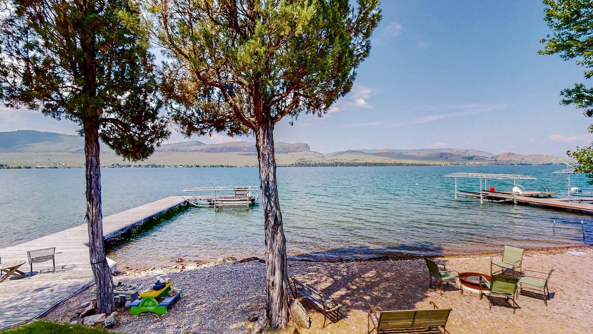 Big Arm House | Lakefront home with private beach, dock, firepit, & grill - dazzling sunset view