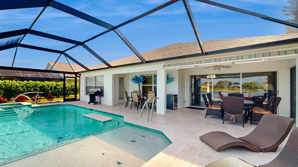 Beachwalk Isles House | Lakefront home with private heated outdoor pool, enclosed lanai, & central AC
