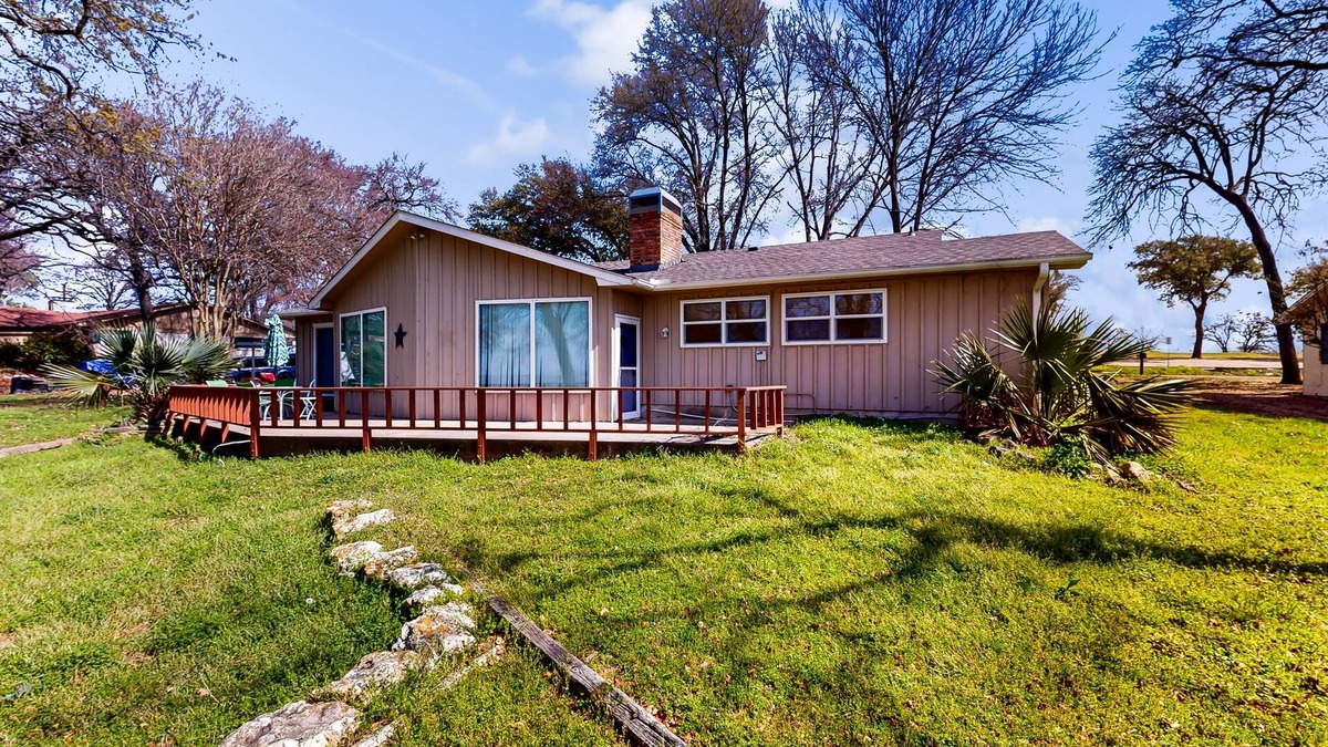 Kemp House | Lakefront retreat near golf course with serene wraparound deck, fireplace, & AC