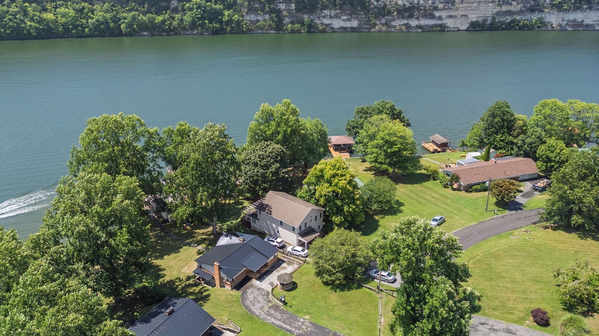 Ingles House | Lakefront retreat with private dock, open living, fire pit, full kitchen & cozy indoor spaces