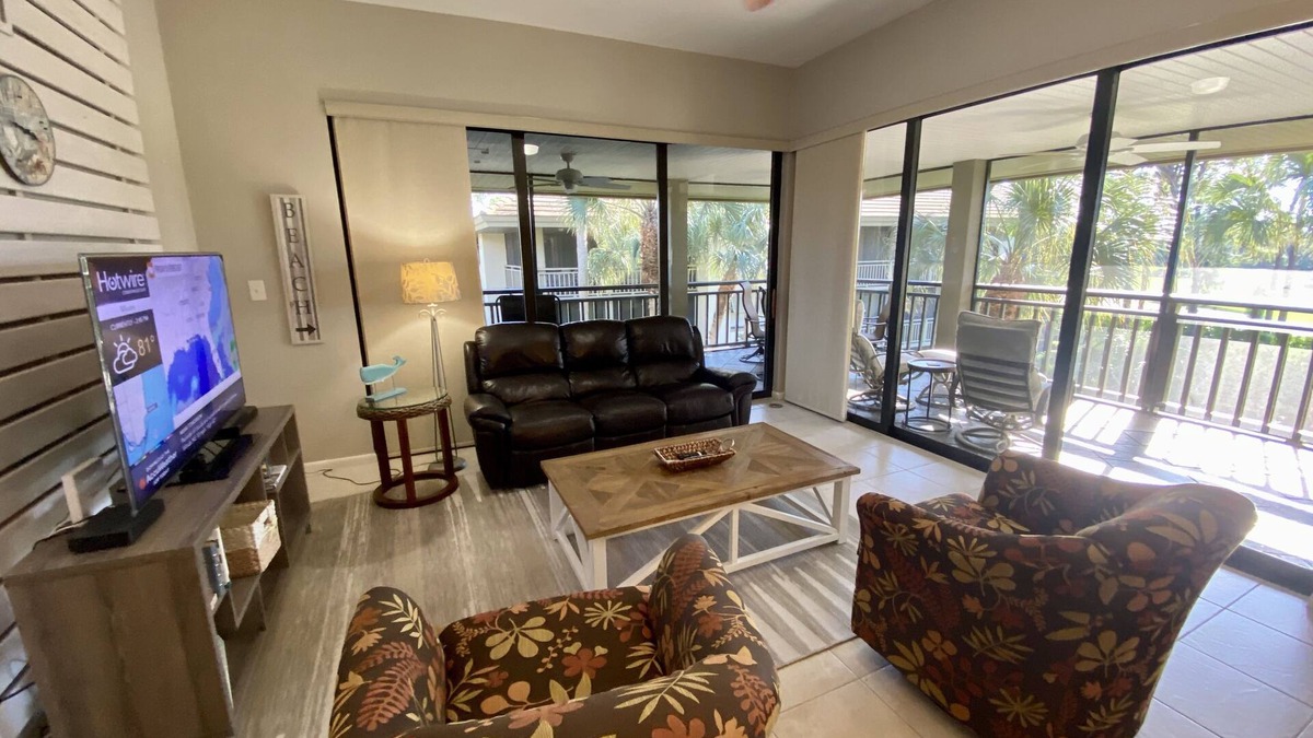 Bonita Bay Condo | LARGE 3RD. FLOOR CORNER UNIT W/GOLF COURSE VIEWS FROM SPACIOUS WRAP AROUND LANAI