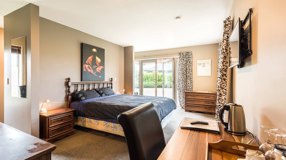 Rolleston House | Large master bedroom with en-suite and bath in our Private House
