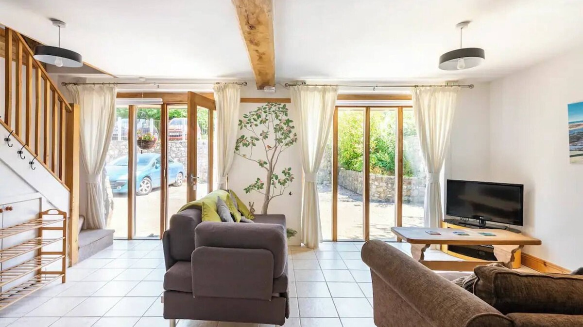 Kemeys Commander Cottage | Light and spacious cottage, with exposed oak beams and floor to ceiling windows