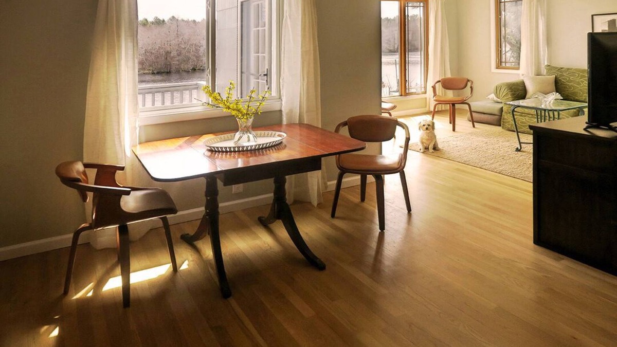 Riverhead House | Light rippling on river, private dock, nature preserve beyond
