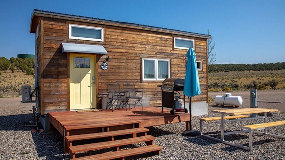 Meeker House | Lion Canyon was built by Mitchcraft in Fort Collins, Colorado as part of HGTV's "Tiny House Hunters". This home has two lofts, each with a Queen bed. One is accessible by stairs and one by ladder.