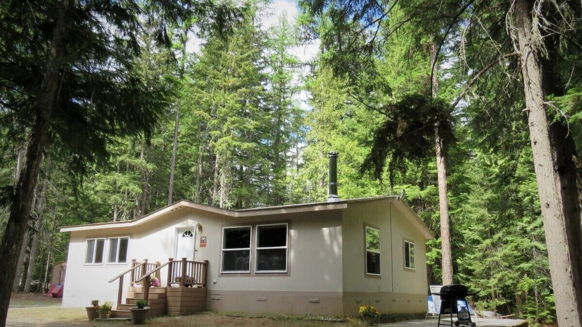 Priest River House | Located in a private wooded area with a lovely creekfront trail to explore.