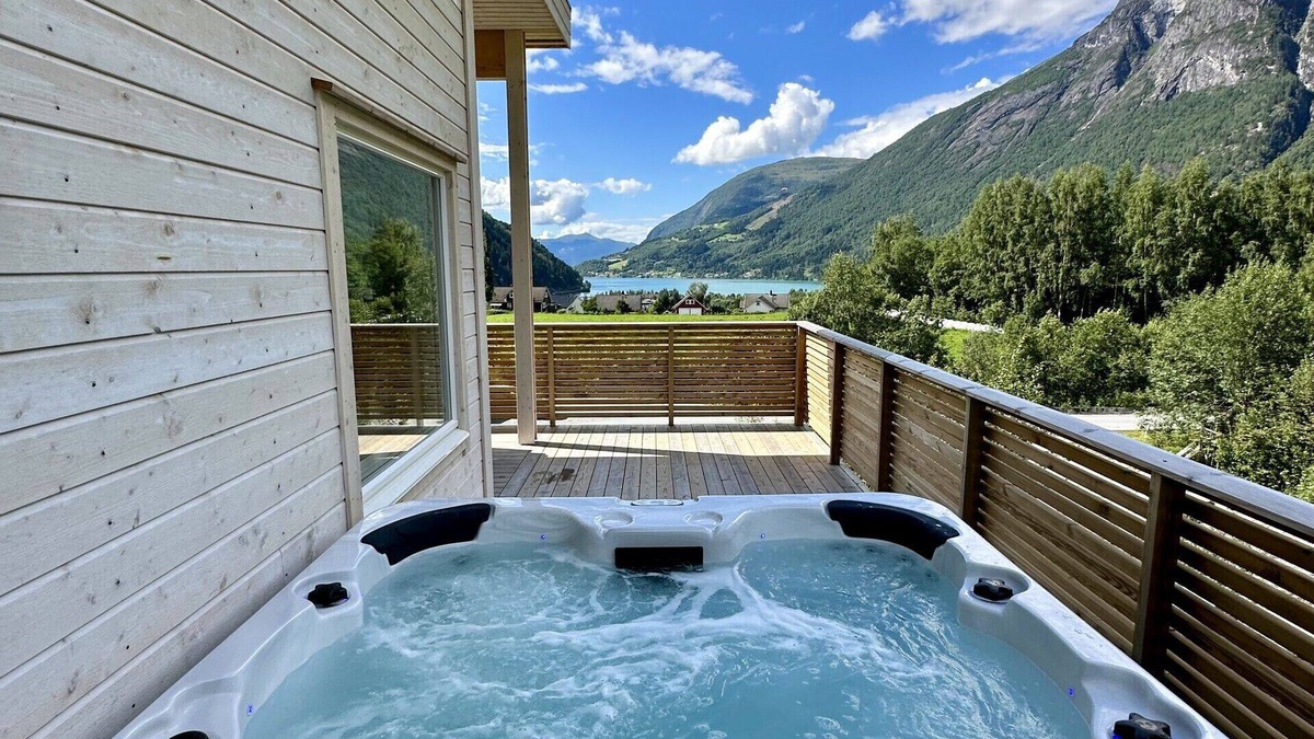 Loen Apartment | Loen Panorama in Stryn, outdoor hot tub with fjord and mountain views
