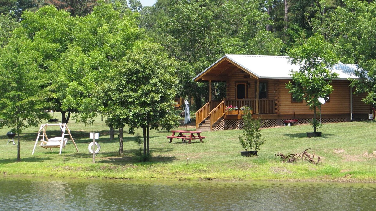 Daingerfield Cabin | Log cabin overlooking a private lake on a working farm