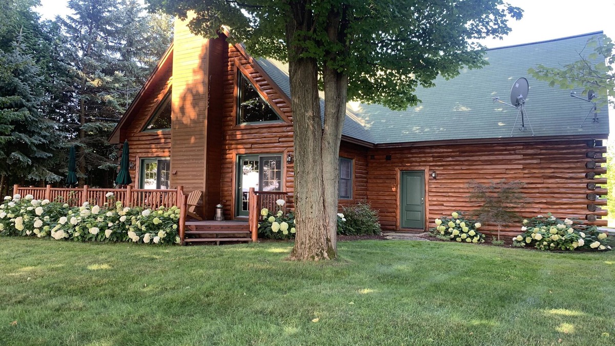 Kewadin House | Log home overlooking Torch Lake