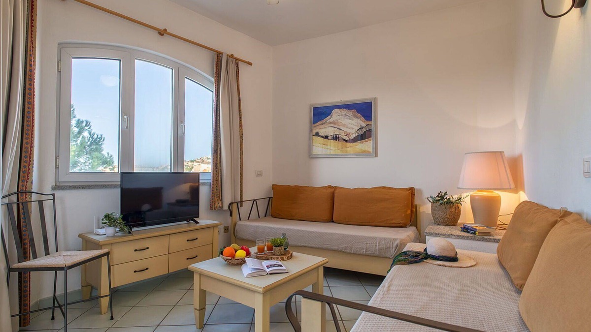 Canneddi Apartment | Lovely apartment for 4 guests with A/C, pool, WIFI, TV, terrace and pets allowed