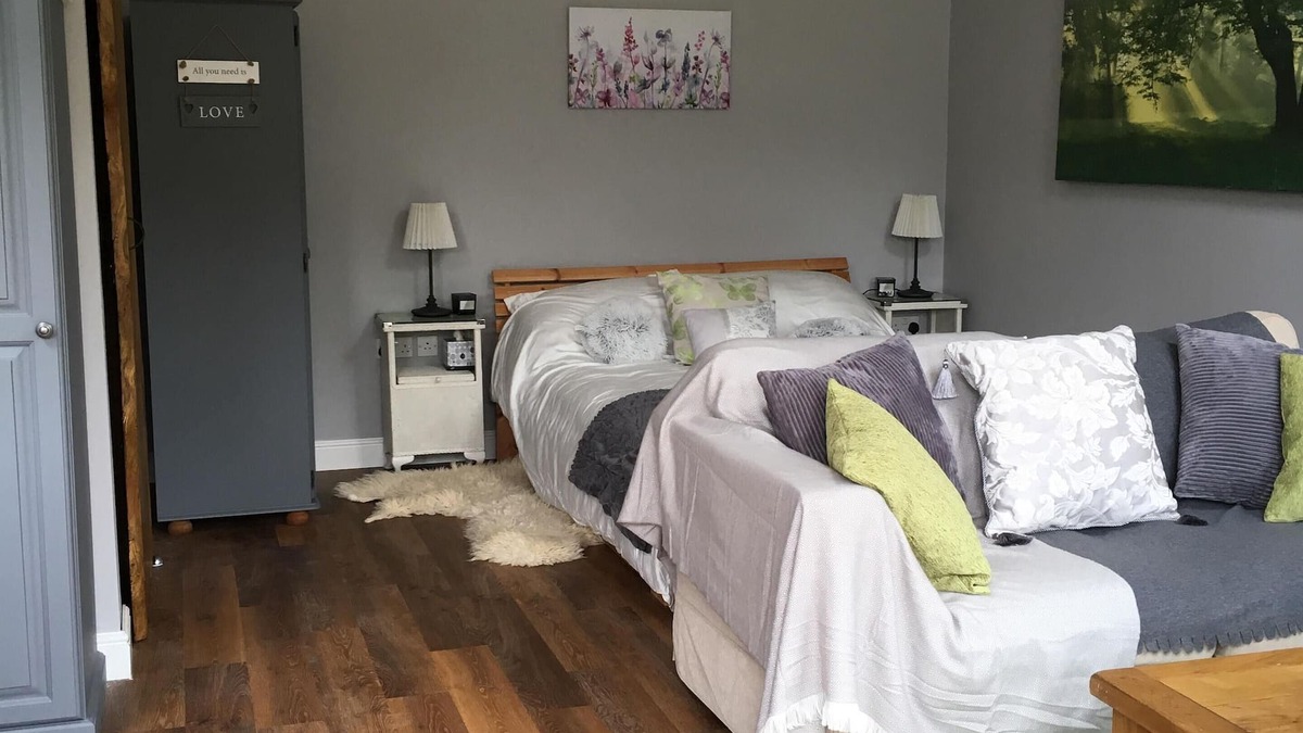 Sandy Lane Cabin | Lovely Wooden Lodge, views over an orchard, outside seating.