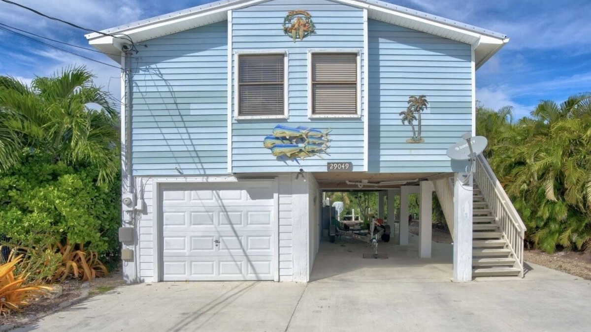 Eden Pines House | Lower Keys on quiet canal front w/boat lift, screened-in porch & Pets Welcome!