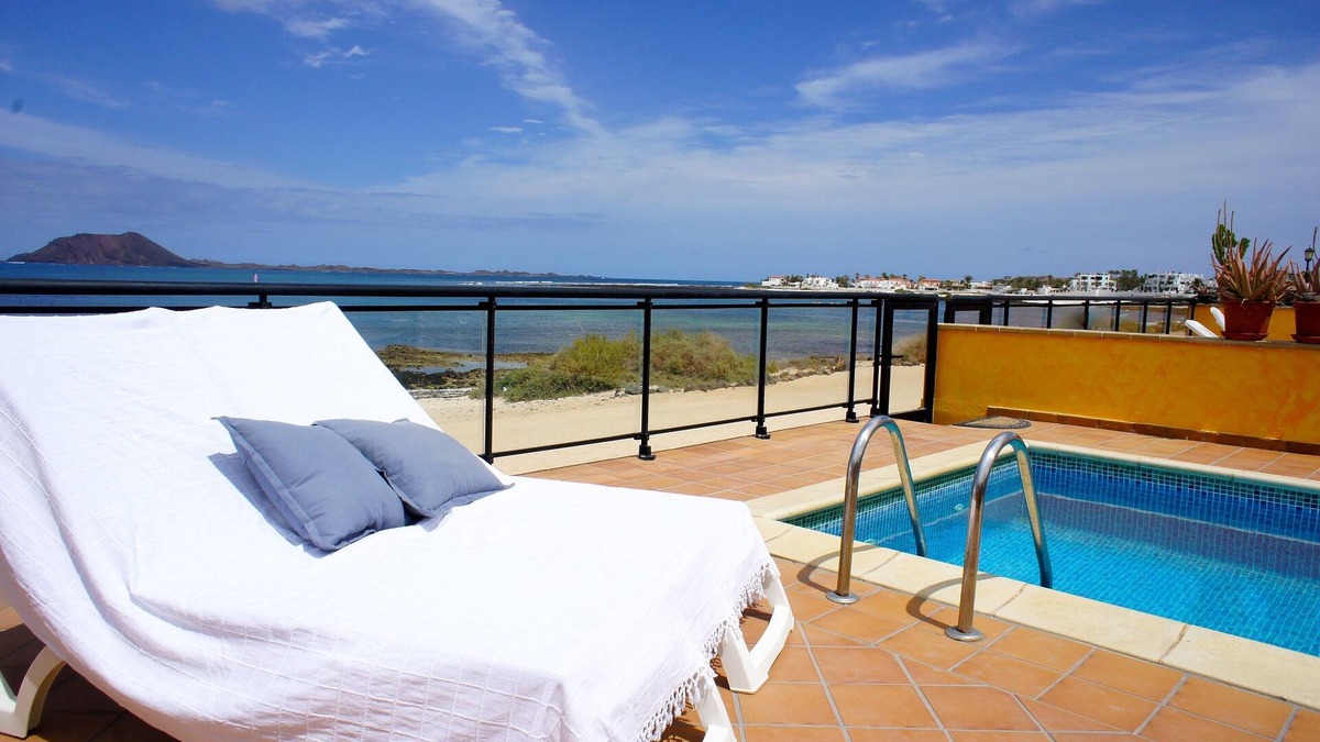 Corralejo Villa | Luxurious beachfront vacation rental home with heated salt water pool