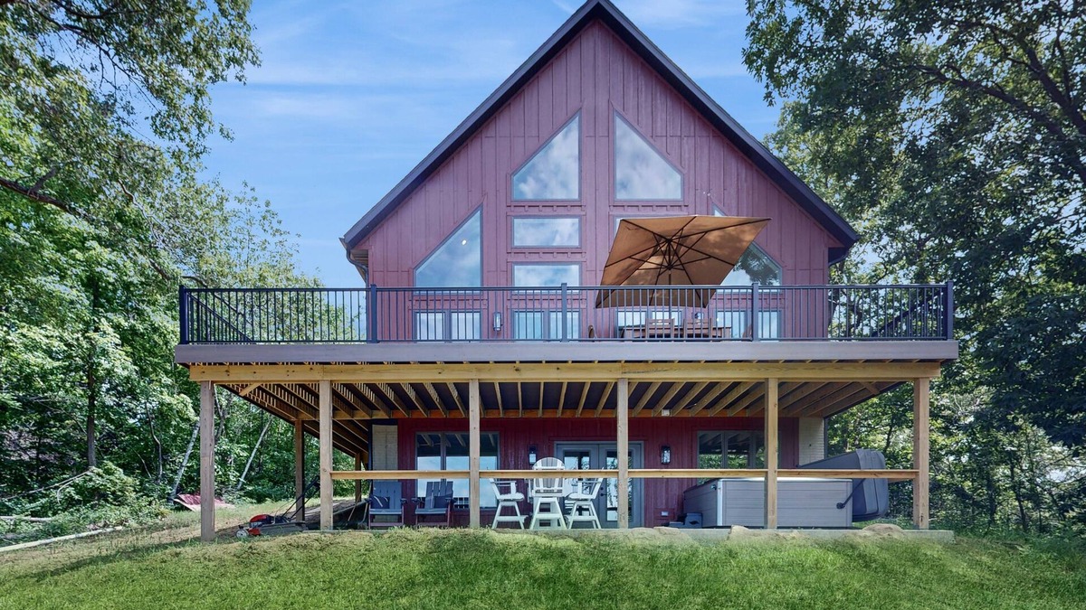 Eastman House | Luxurious home with hot tub, electric fireplace, and stunning views