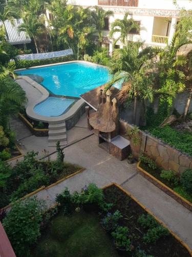 Tawala Apartment | Luxury 4BR Apartment with Pool behind Alona Beach